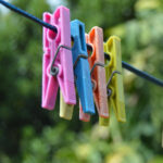 Clothes line with 5 coloured pegs
