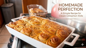Freshly baked cinnamon rolls in a white rectangular casserole dish, with a secondary glass dish in the background.